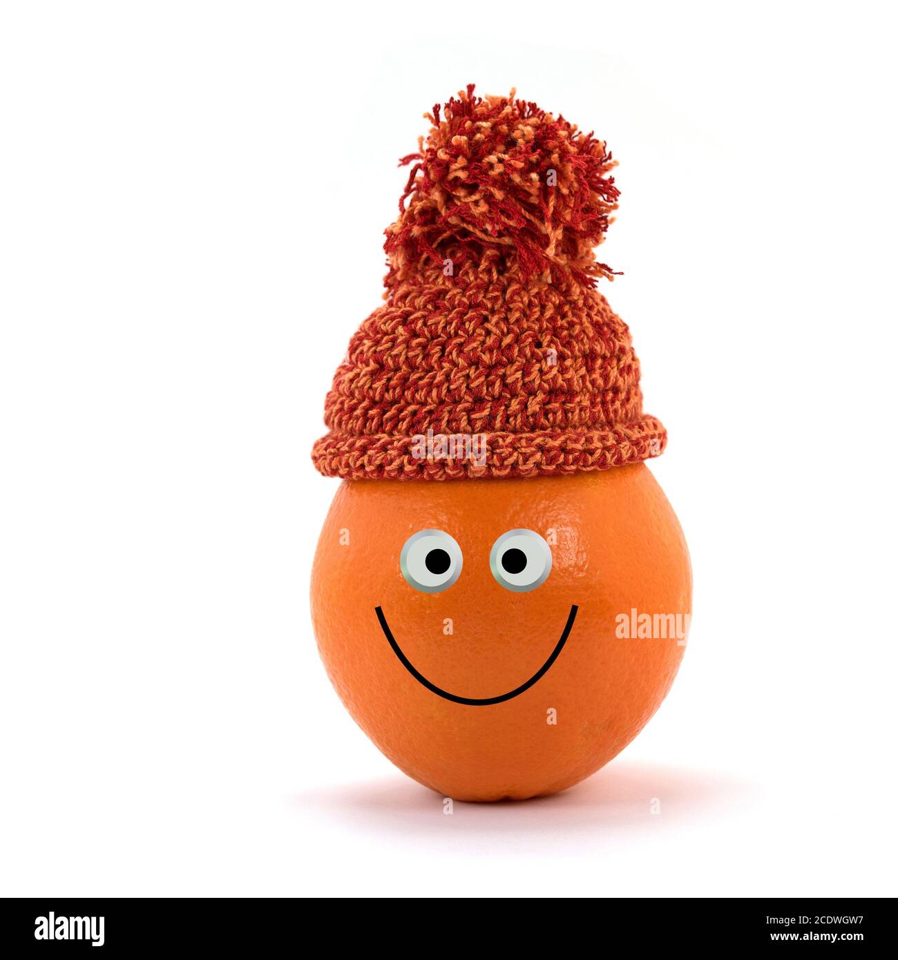 Orange avec chapeau et visage amusant Banque D'Images