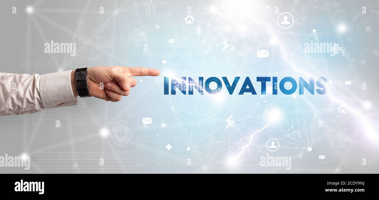 Pointant du doigt sur l'inscription INNOVATIONS, concept de technologie moderne Banque D'Images