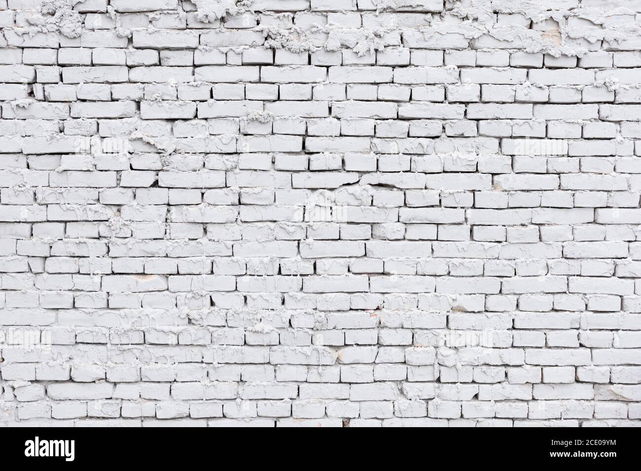 mur de briques blanc rugueux avec un fond de plâtre qui fuit Banque D'Images