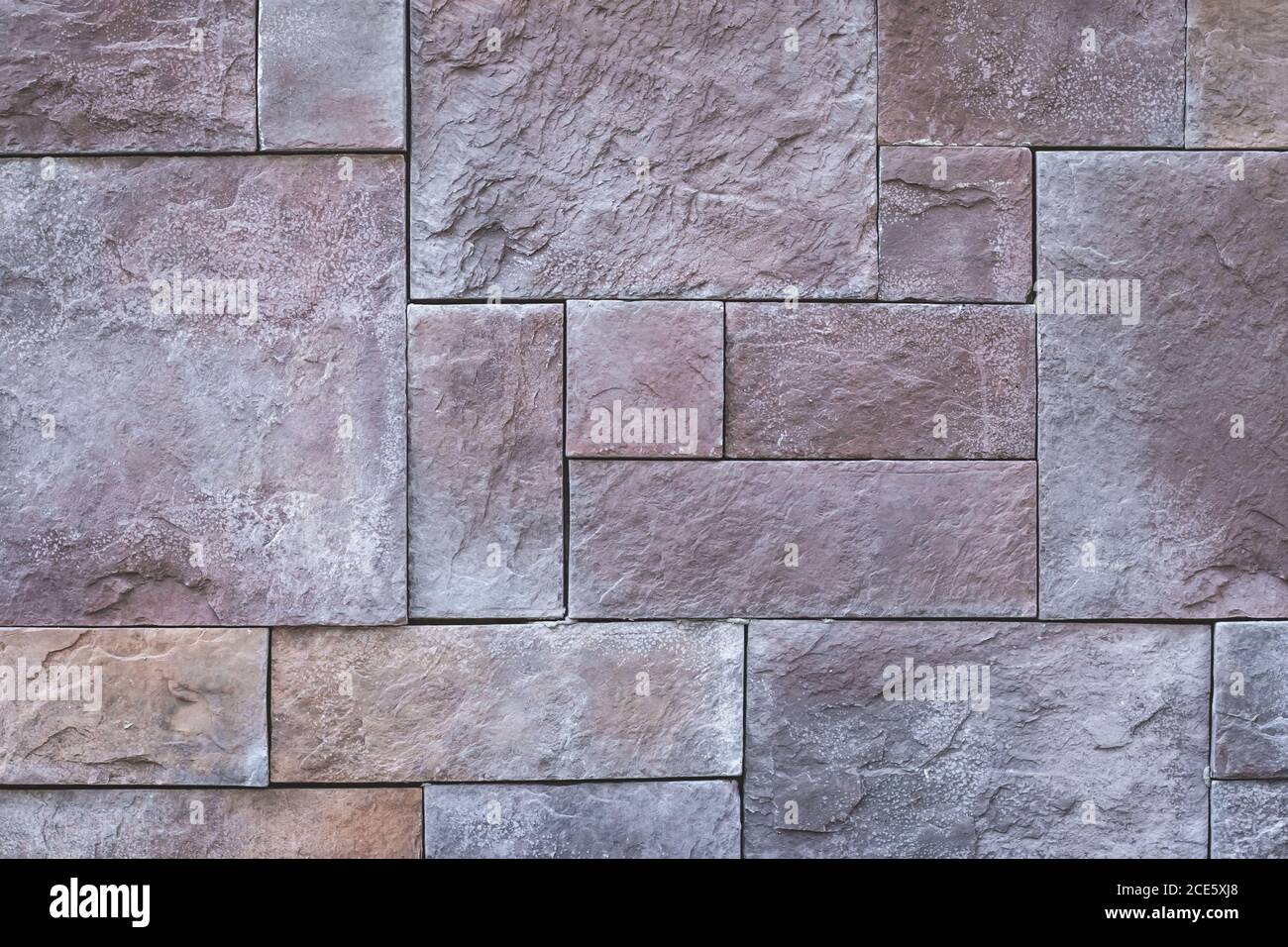 Fond abstrait de carrés, texture de mur de pierre, sol carrelé brun, trottoir. Surface en brique de granit. Architecture, conception de maçonnerie. Grunge le papier peint. Ex Banque D'Images