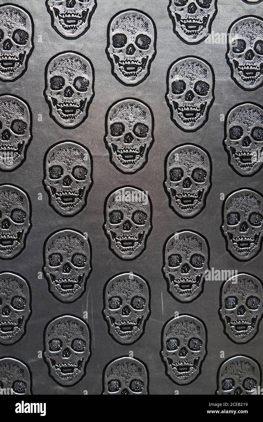 Motif de crânes sur surface grise Banque D'Images