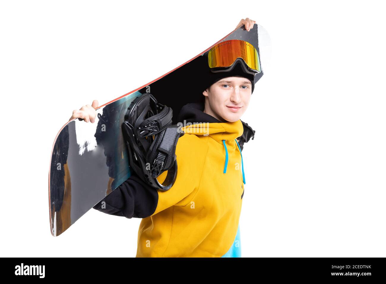 Le snowboarder masculin maintient le snowboard sur fond blanc isolé Banque D'Images