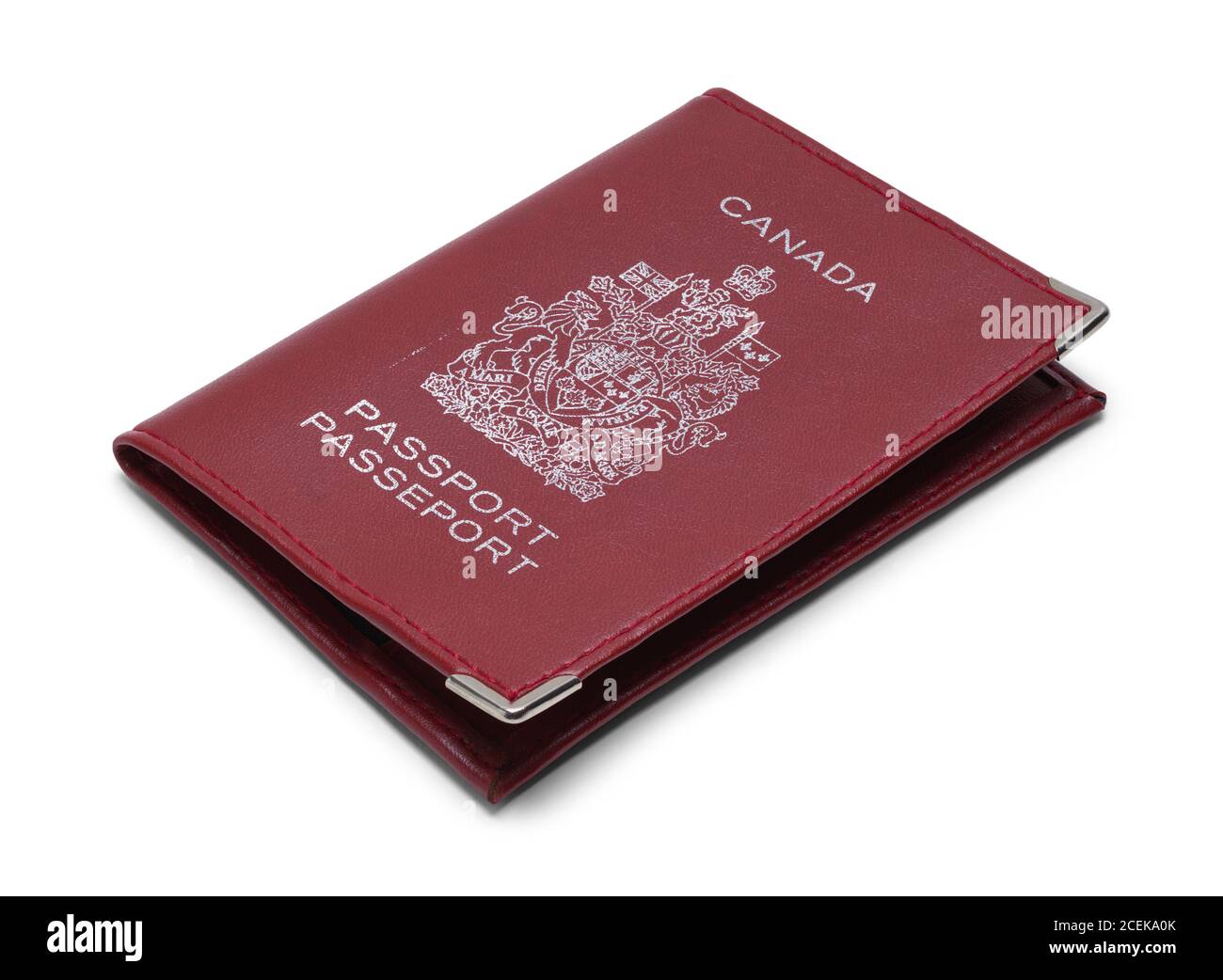 Passeport candaien rouge isolé sur blanc. Banque D'Images