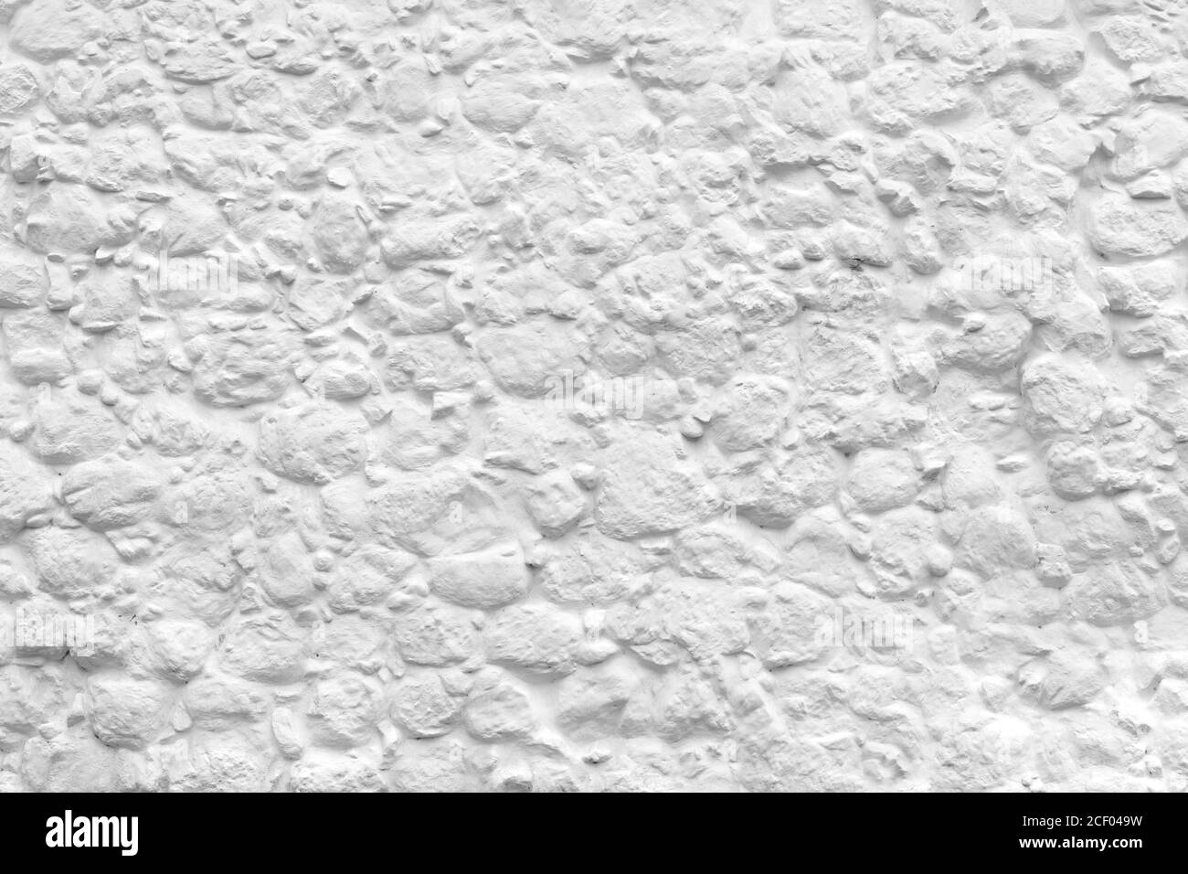 Blanc belle texture naturelle d'une pierre recouverte d'argile dans la peinture. Le mur de l'ancien bâtiment historique. Place pour le texte sur la ville fait main facade Banque D'Images