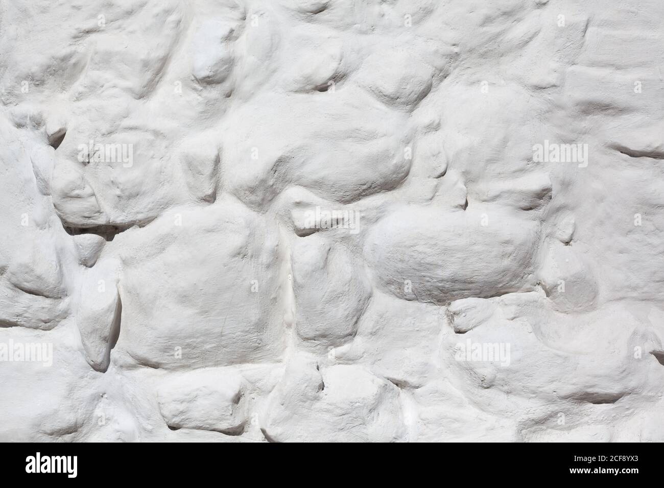 Mur de pierre blanchi texturé, texture de pierres rugueuses peintes, mur de monastère, arrière-plan abstrait Banque D'Images