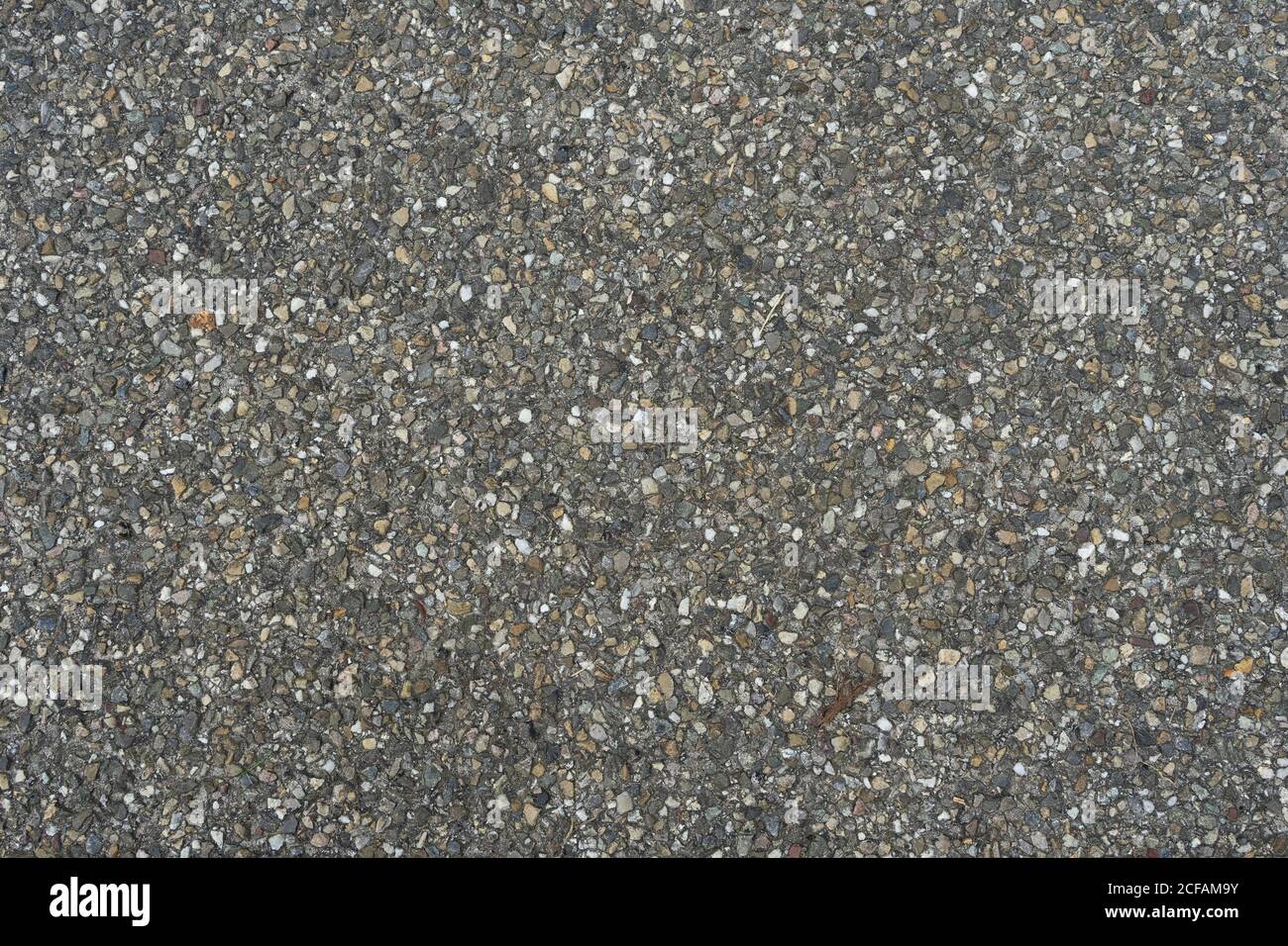 texture de la route asphaltée au goudron avec de petits morceaux de cailloux motif de texture Banque D'Images