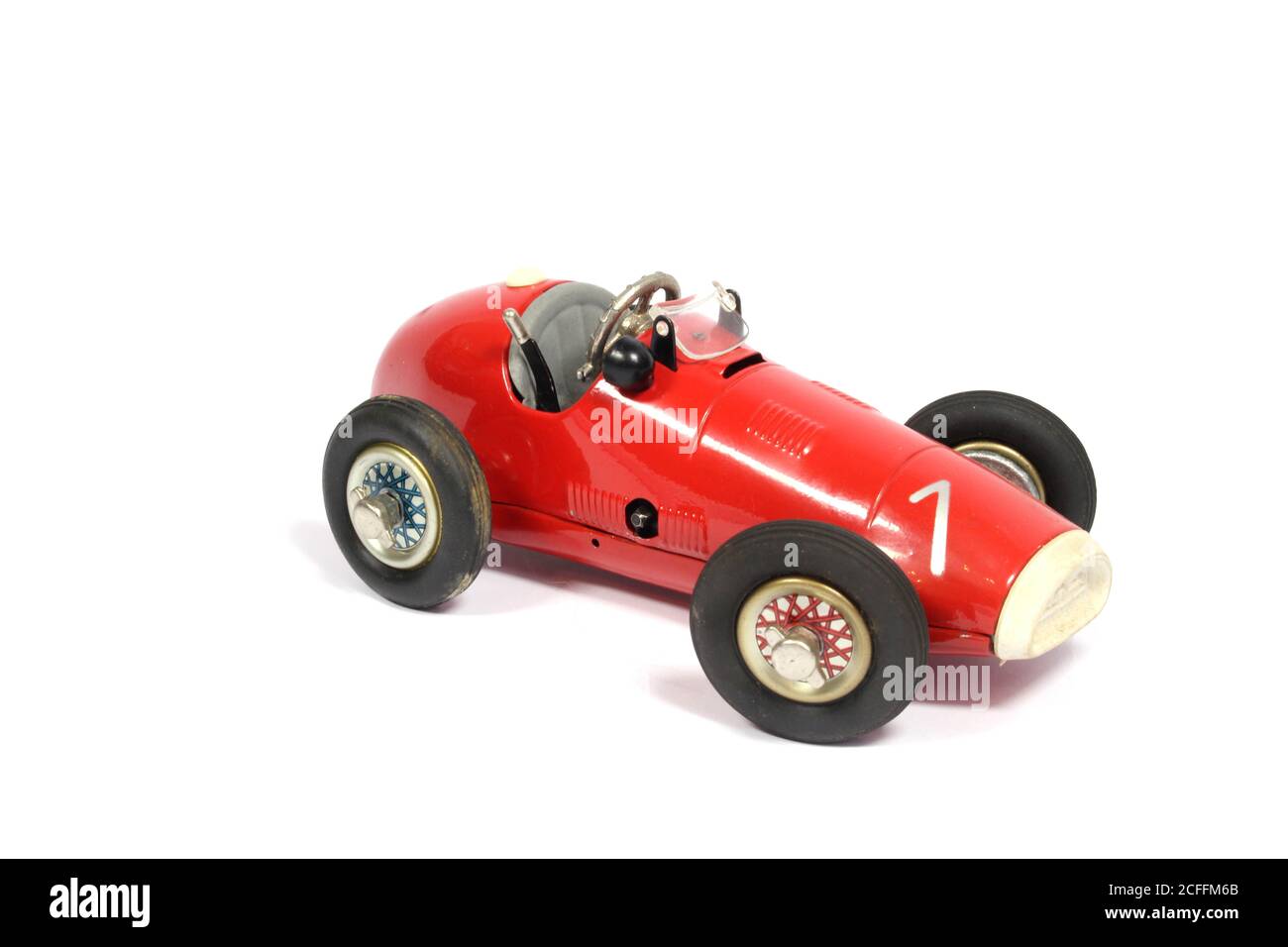 Une voiture de course Vintage Classic Toy Tin sur fond blanc Banque D'Images