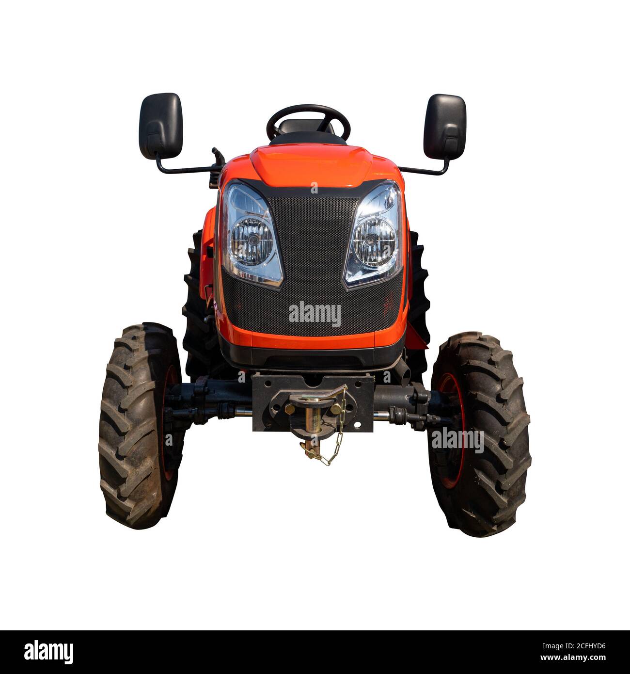 Petit tracteur rouge isolé sur blanc Banque D'Images