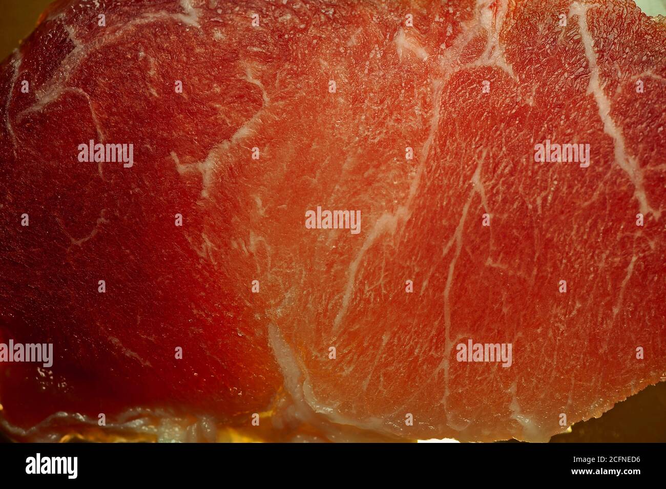 photo d'une fine section de viande de porc avec illumination du bas pour l'arrière-plan Banque D'Images