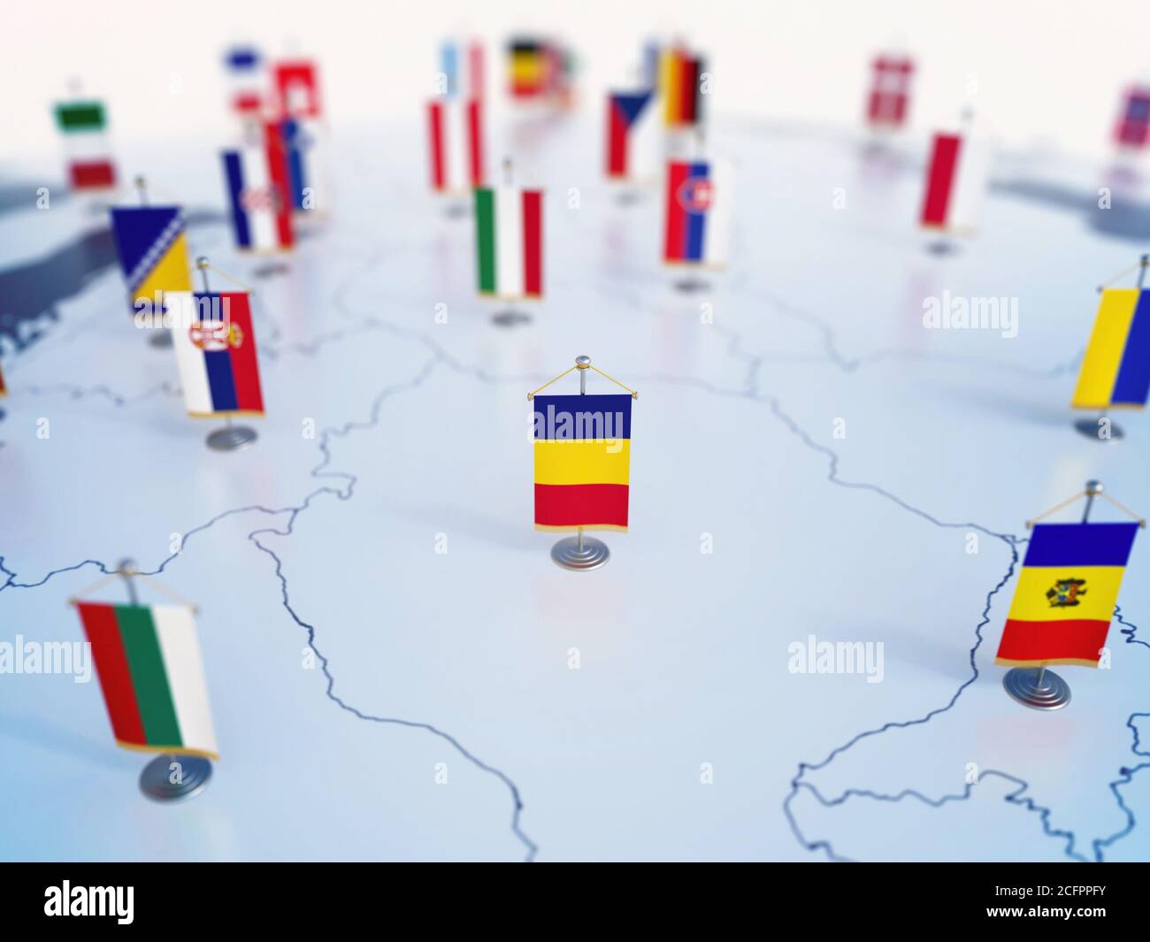 Drapeau de la Roumanie au centre des drapeaux des autres pays européens. L'Europe est marquée par des indicateurs de table rendu 3d Banque D'Images