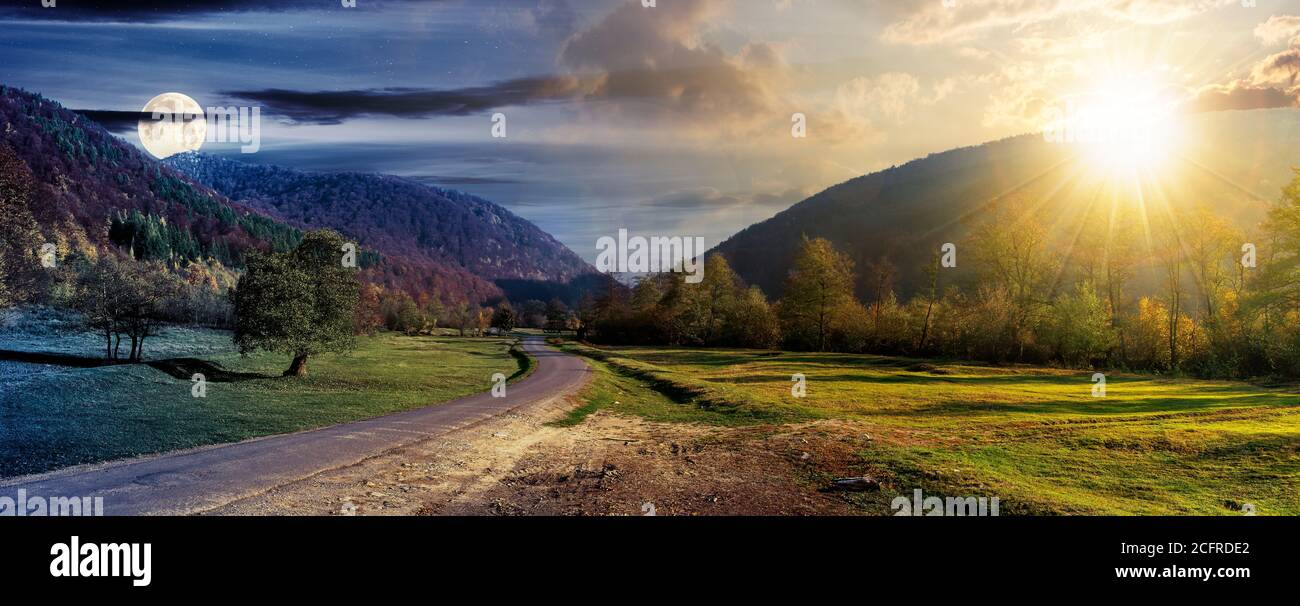 concept de changement de jour et de nuit au-dessus de la route de campagne dans la vallée. paysage d'automne merveilleux dans les montagnes avec le soleil et la lune. forêt sur les collines en couleur Banque D'Images