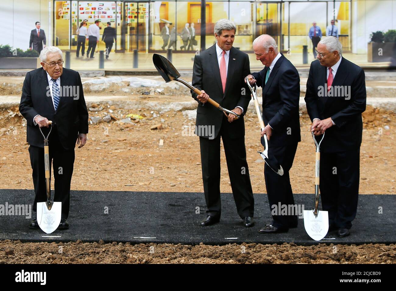 U.S. Secretary of State John Kerry (3rd R) jokes with former Secretaries of  State Henry Kissinger (L), James Baker (2nd R) and Colin Powell (R) at a  cermonial groundbreaking for the U.S.