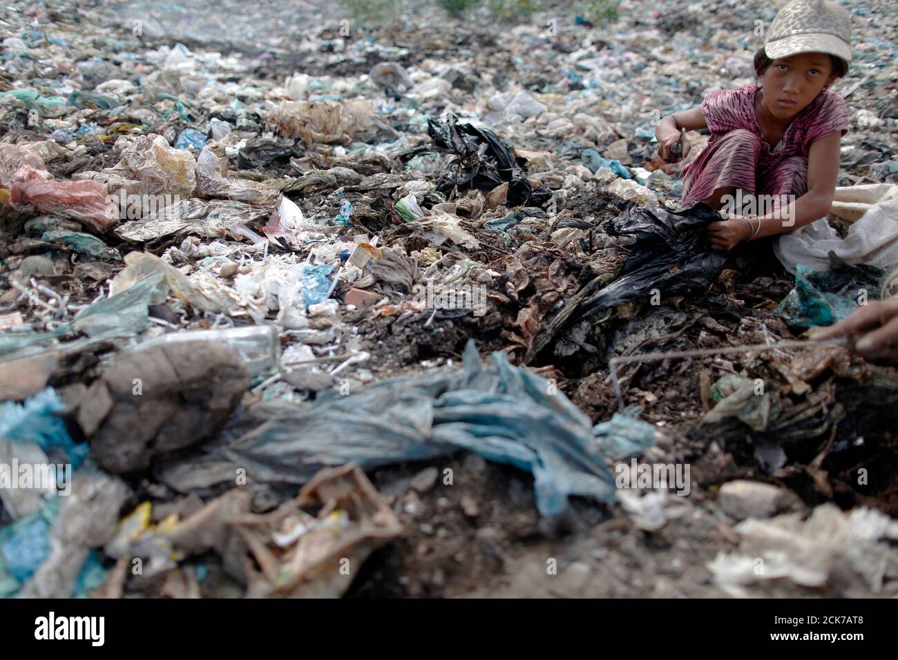 Thach Chanthy A 13 Year Old Cambodian Orphan Whose Father Died Of Aids And Mother Abandoned Her With Two Younger Brother And Sister Searches For Plastic At The Steng Meanchey Dump Site Outside Phnom Thach Chanthy A 13 Year Old Cambodian Orphan Whose Father Died Of Aids And Mother Abandoned Her With Two Younger Brother And Sister Searches For Plastic At The Steng Meanchey Dump Site Outside Phnom