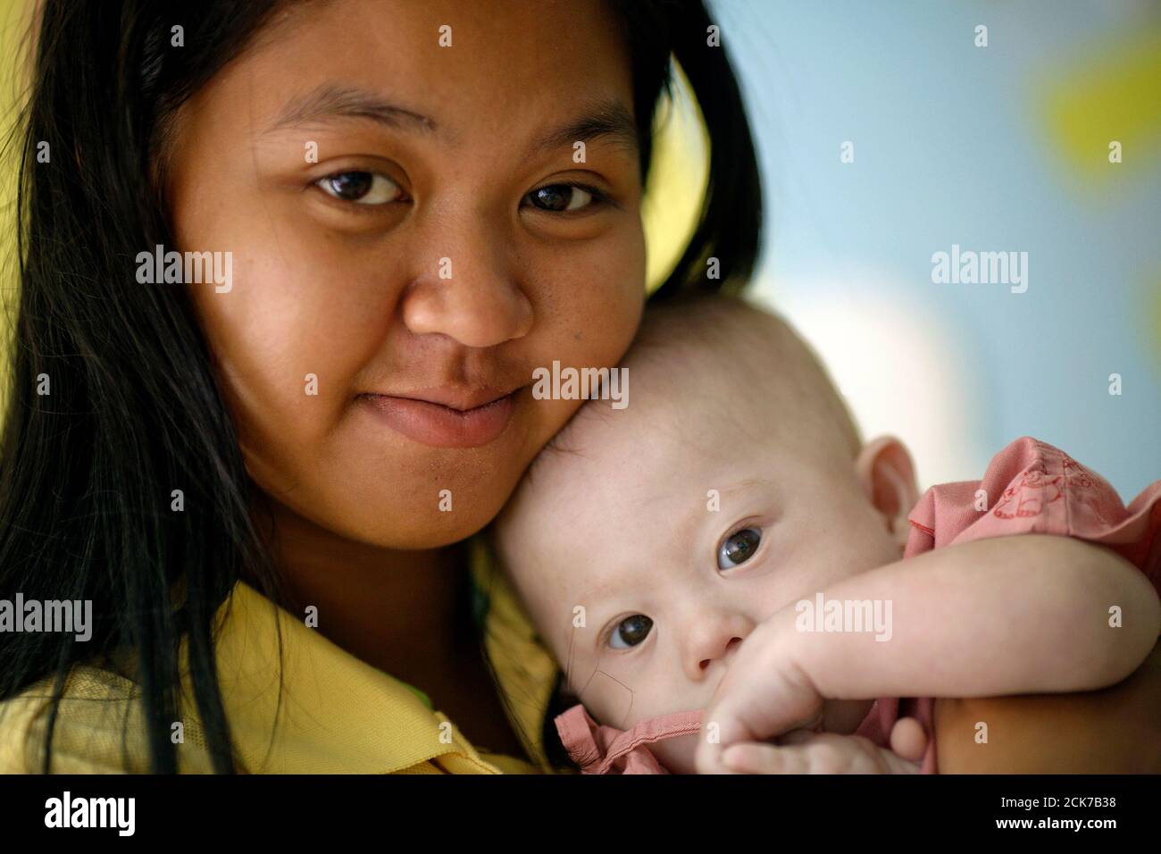 Gammy A Baby Born With Down S Syndrome Is Fed By His Surrogate Mother Pattaramon Janbua At A Hospital In Chonburi Province August 3 14 According To Pattaramon His Australian Parents Through A Gammy A Baby Born With Down S Syndrome Is Fed By His Surrogate Mother Pattaramon Janbua At A Hospital In Chonburi Province August 3 14 According To Pattaramon His Australian Parents Through A