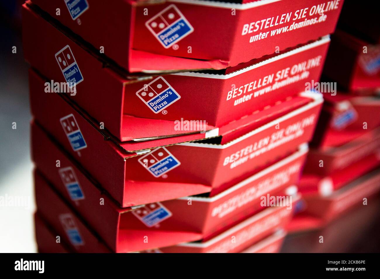 Delivery boxes for take-away pizzas are stacked at a Domino's Pizza store in August 19, 2013. Can a British food chain with U.S. sell Italian pizza to the Domino's