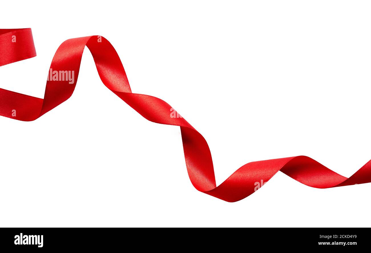 Un ruban rouge curly pour Noël et anniversaire présente bannière isolée sur un fond blanc. Banque D'Images