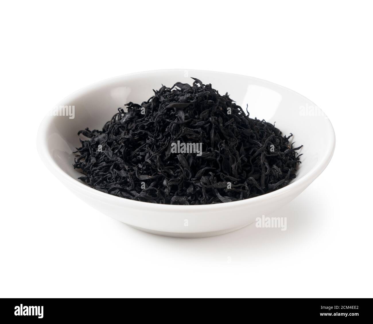 Un hihihiki séché dans une assiette sur un fond blanc Banque D'Images