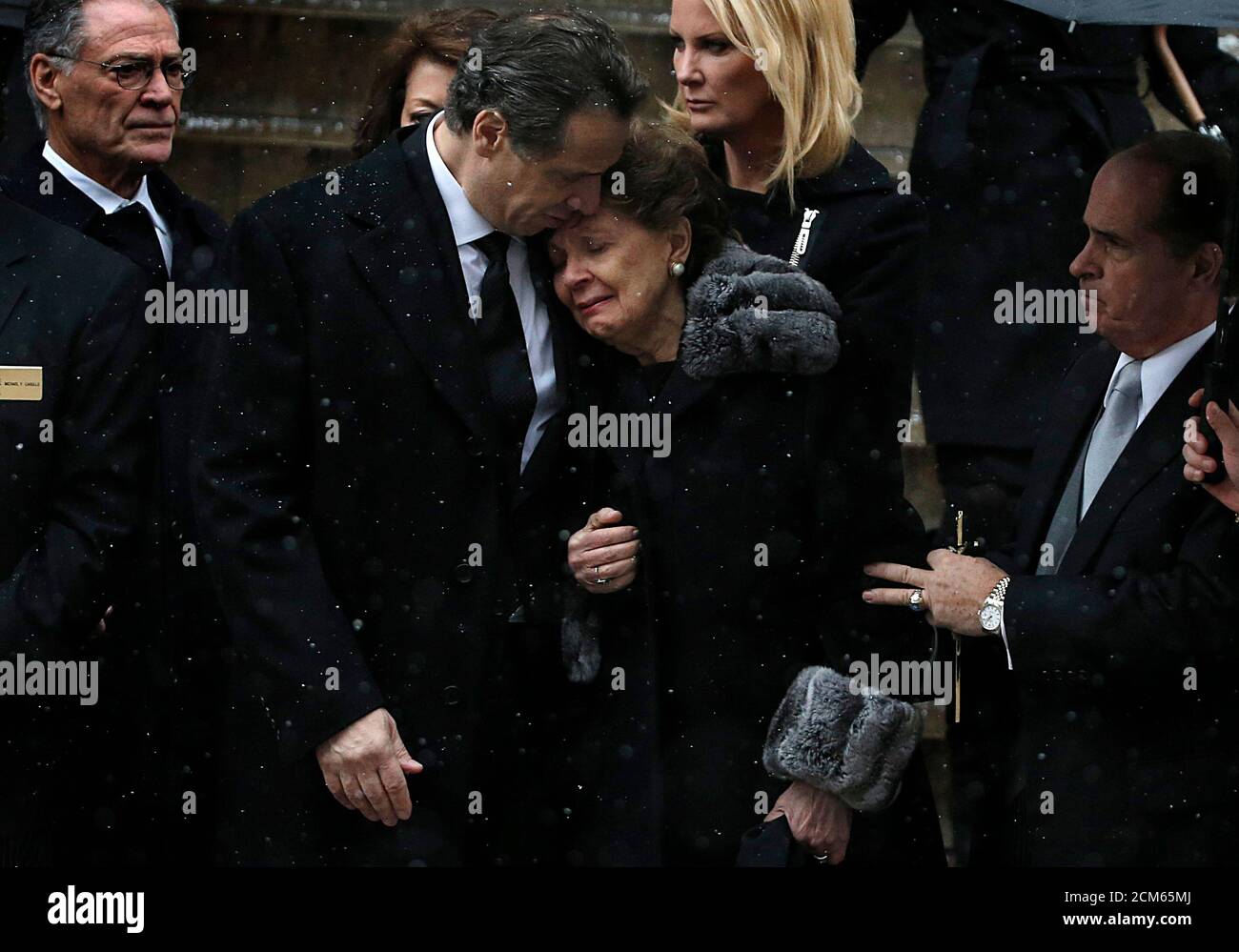 New York Governor Andrew Cuomo comforts his mother Matilda ...