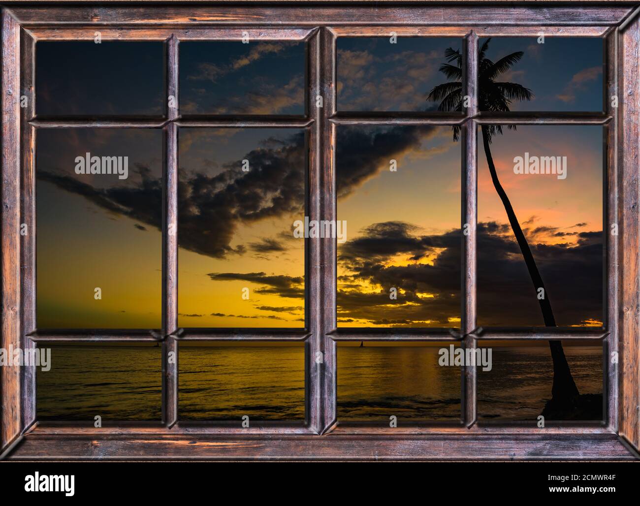 Vue depuis la fenêtre ouverte de la coucher du soleil des caraïbes Banque D'Images