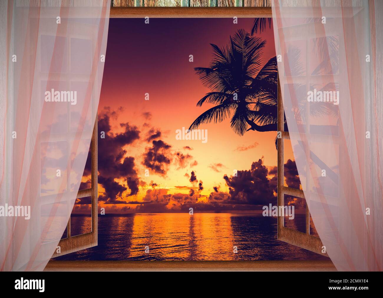 fenêtre ouverte avec vue sur la mer au coucher du soleil Banque D'Images