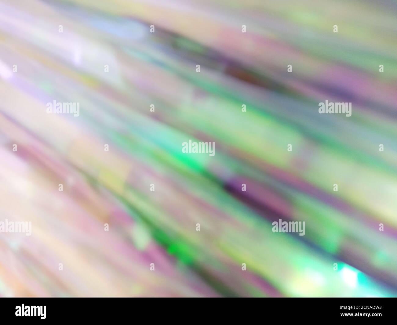 Arc-en-ciel brillant holographique véritable multicolore texture background froissé. Banque D'Images
