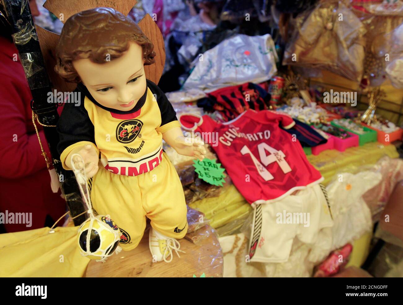A Doll L Of Baby Jesus Dressed In Mexico S Club America S Soccer Jersey Is Displayed Next To A Replica Jersey Of Soccer Player Chicharito Of Manchester United For The Candelaria Day Celebration