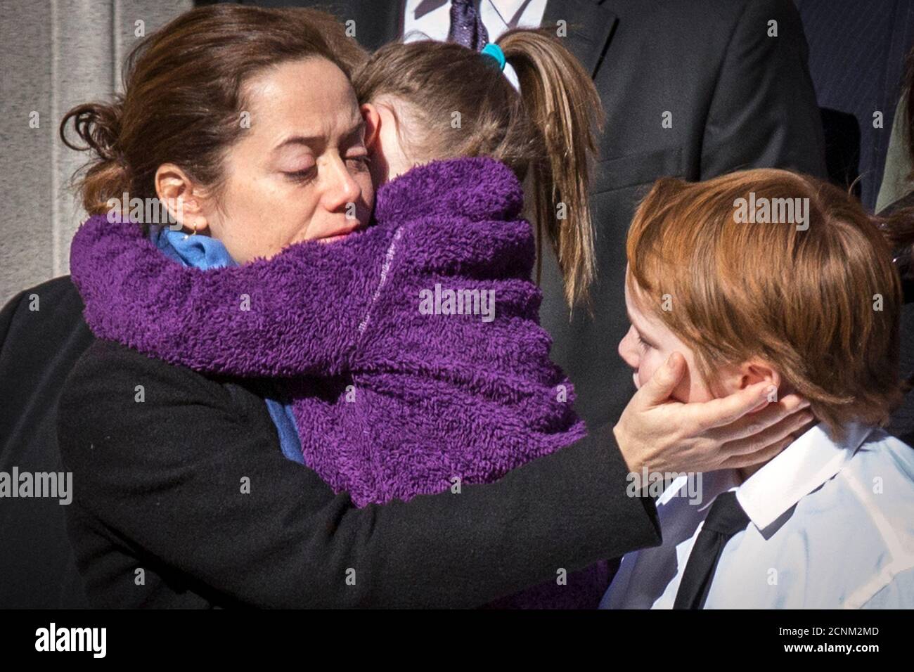 Mimi O'Donell (C), former partner of actor Phillip Seymour Hoffman, holds  her daughter Willa as the casket arrives for the funeral of actor Phillip  Seymour Hoffman in the Manhattan borough of New