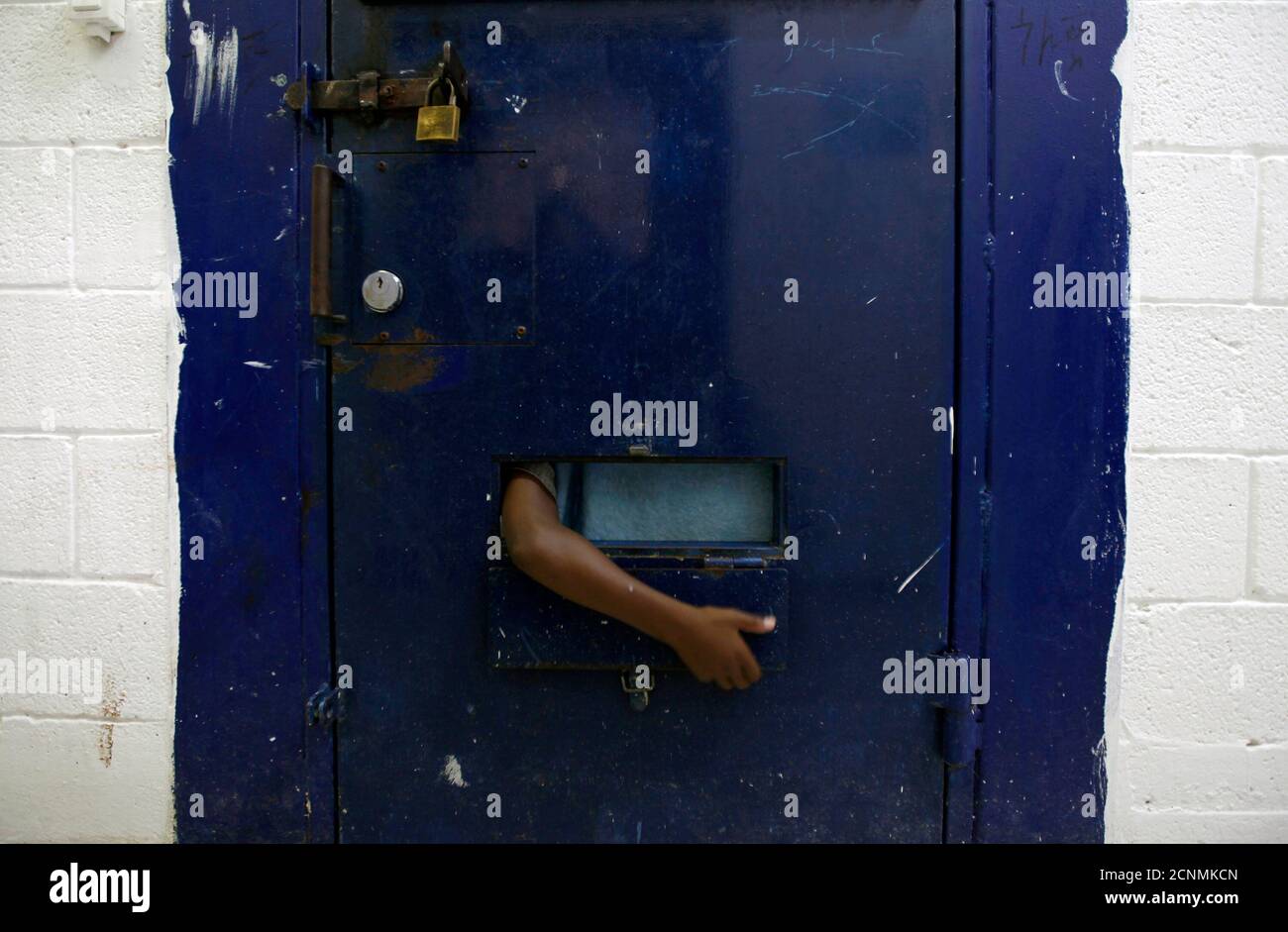 A Young Refugee From Eritrea Reaches His Arm Out Of His Cell At Givon Prison In Ramle Near Tel Aviv August 2 10 Some 40 Eritrean Youths Between The Ages Of 13