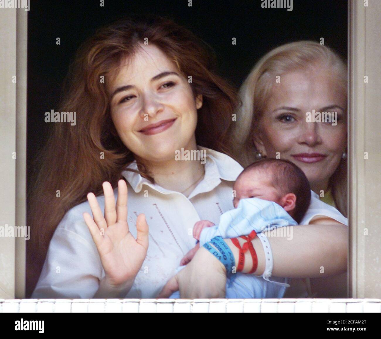 Former Mexican Pop Star Gloria Trevi L Holds Her Newborn Son Angel Gabriel Up For Some Morning Light As Her Mother Gloria Ruiz Looks On At Brasilia S Regional North Hospital March 7