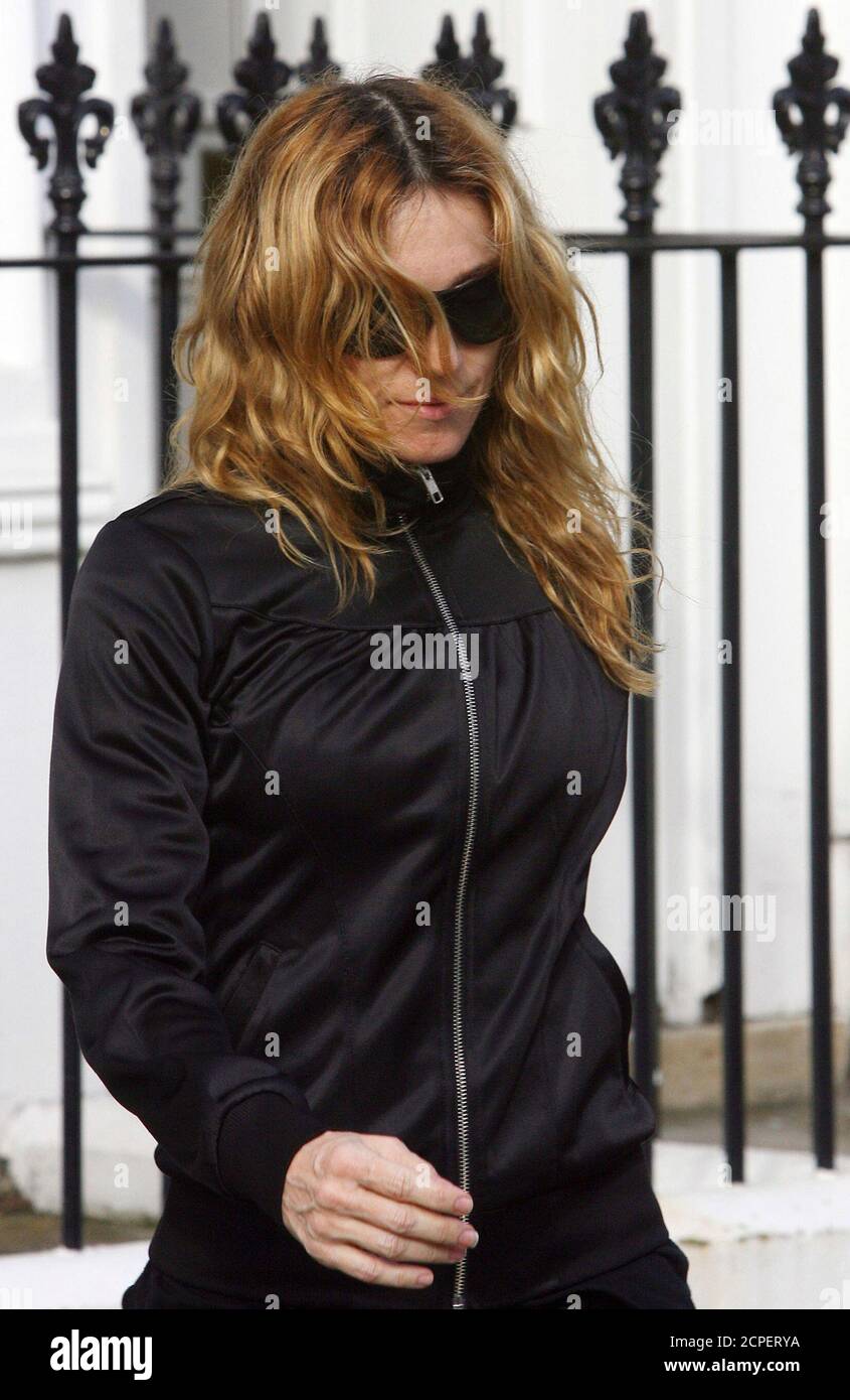 Pop superstar Madonna leaves a gym in northwest London October 18, 2006.  Madonna defended her decision to adopt a one-year-old Malawian boy on  Tuesday, after the child was flown to London overnight