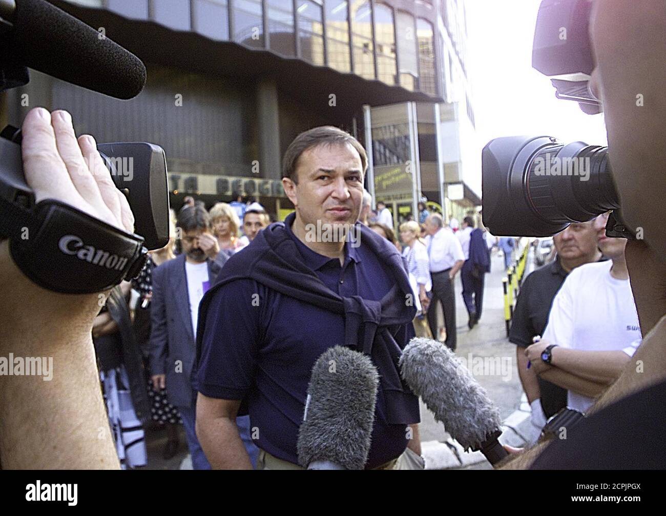 Dragan Kojadinovic, director and editor-in-chief of opposition-run Studio B  television speaks to the media May 17 in front of the commercial building  in central Belgrade, which also houses Blic independent newspaper and