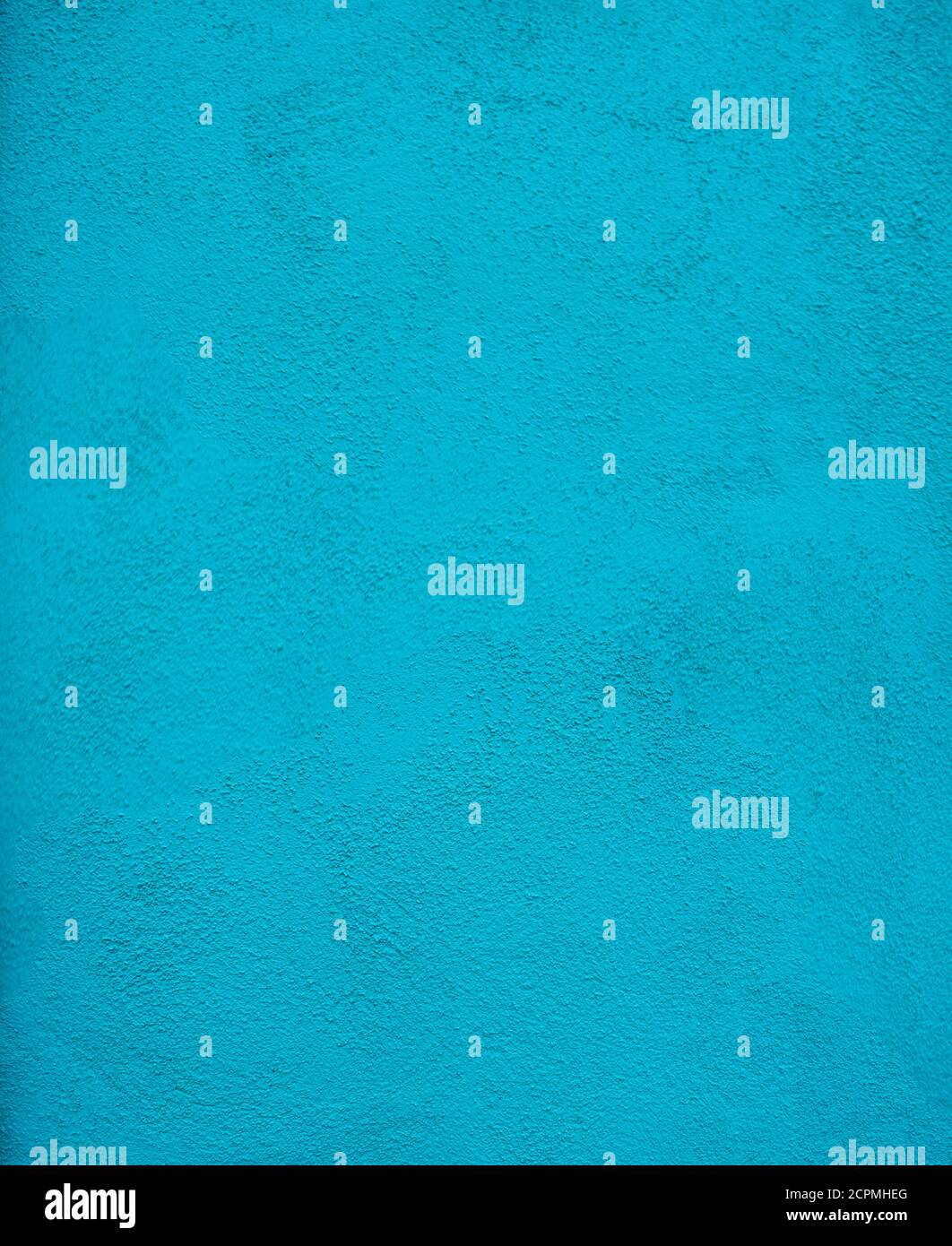 Gros plan sur un mur en stuc peint turquoise Banque D'Images
