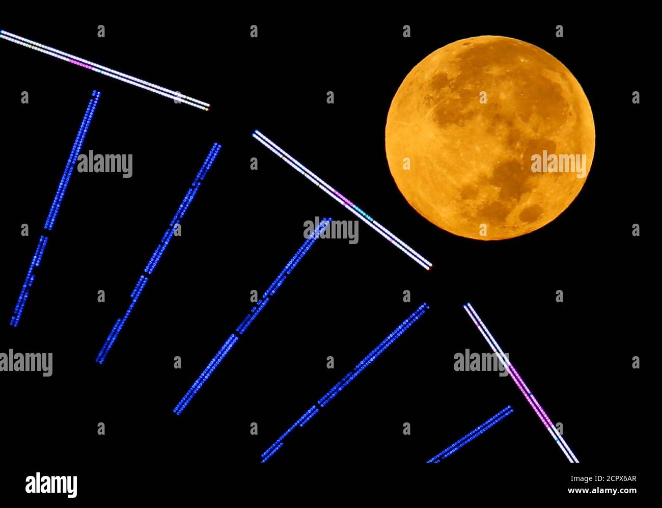 The Moon Is Pictured Behind A Ferris Wheel On The Pier In Santa Monica California After A Total Lunar Eclipse Also Known As A Blood Moon October 8 14 The Coppery Reddish