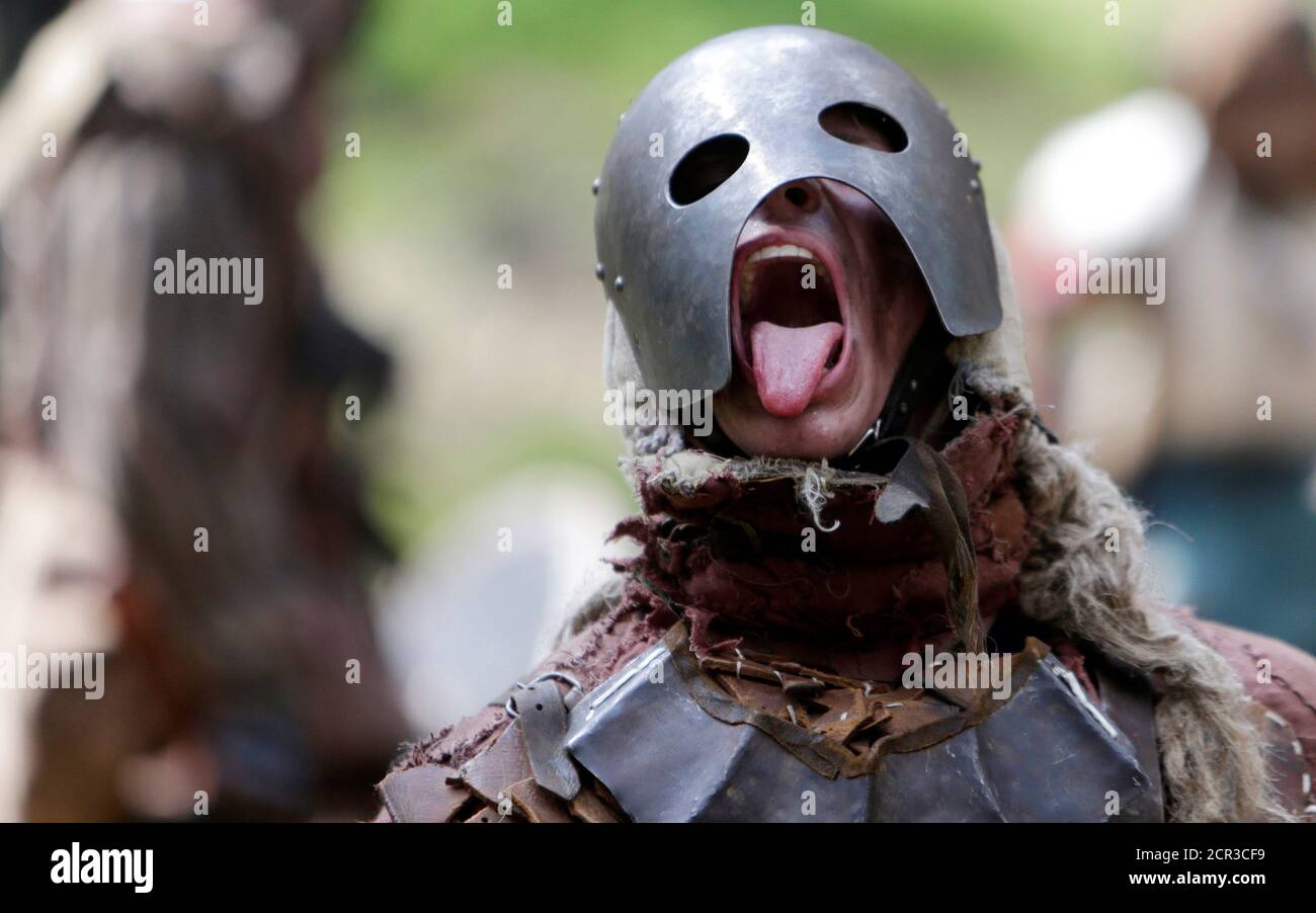 Participants dressed as characters such as elves, dwarves, goblins and orcs  from the J.R.R. Tolkien's novel "The Hobbit" re-enact the "Battle of Five  Armies" in a forest near the town of Doksy,