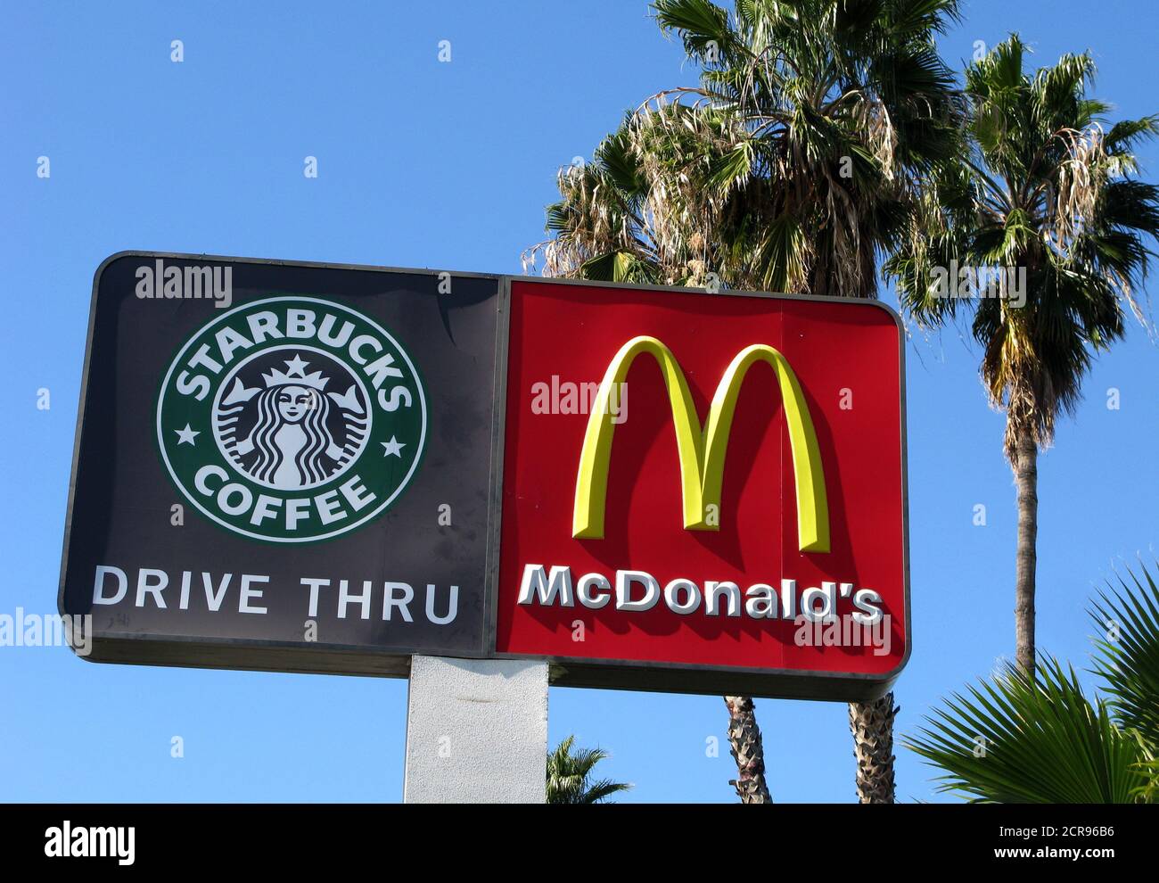 Signs for a McDonald's fast food restaurant and a Starbucks cafe are seen  in Loma Linda, California in this February 28, 2010 file photo. McDonald's  Corp reported on April 21, 2010, a