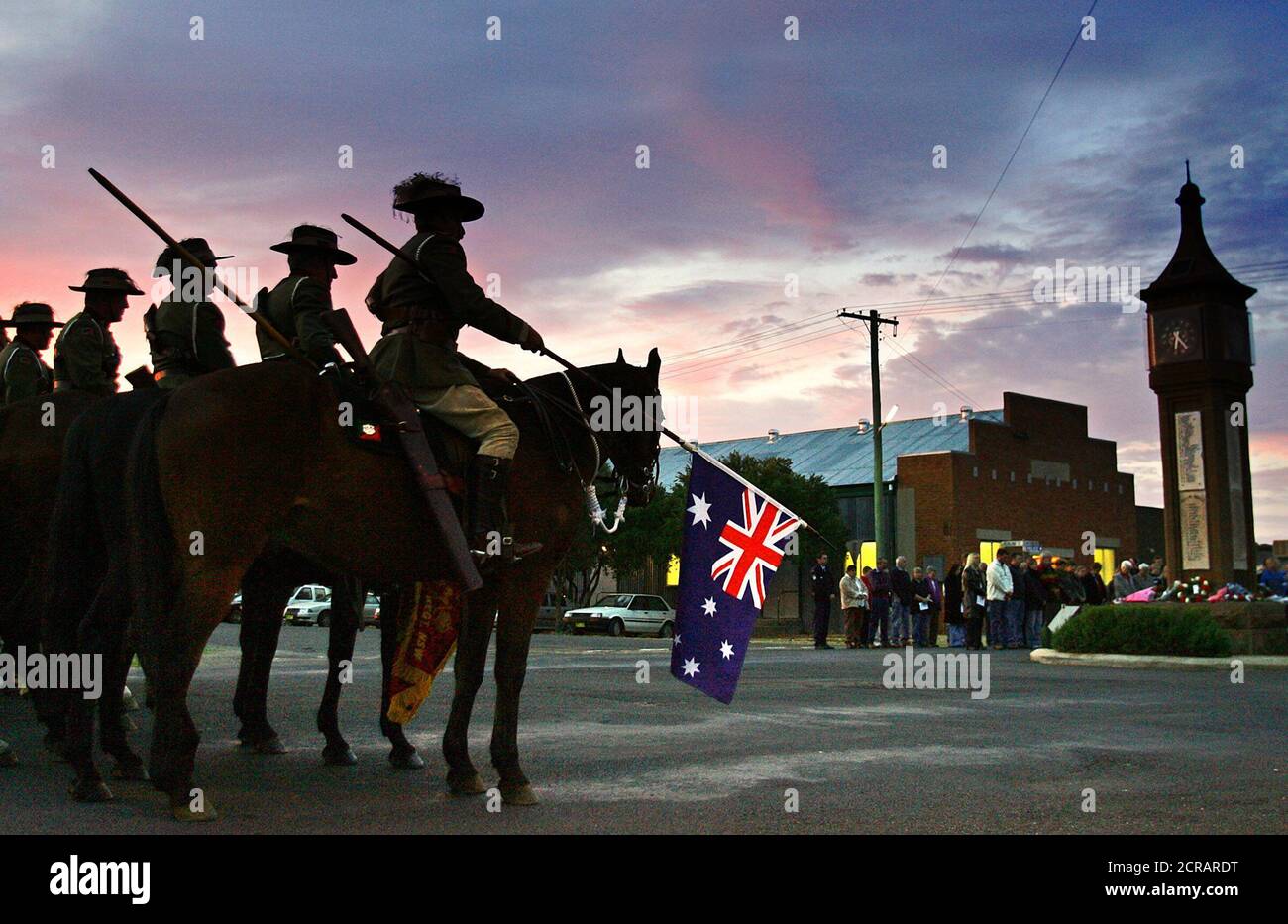 Members of the Australian Light Horse watch over an Anzac Day service in Bogan Gate in the west of Sydney. Members of the Australian Light Horse watch over an