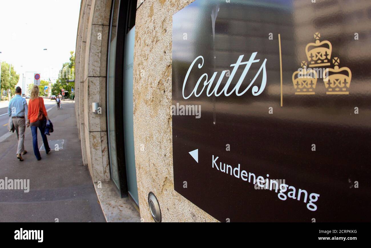 People walk past a sign marking the clients entrance of bank Coutts in  Zurich July 14, 2012. Authorities in the German state of North  Rhine-Westphalia have bought a CD from Switzerland containing