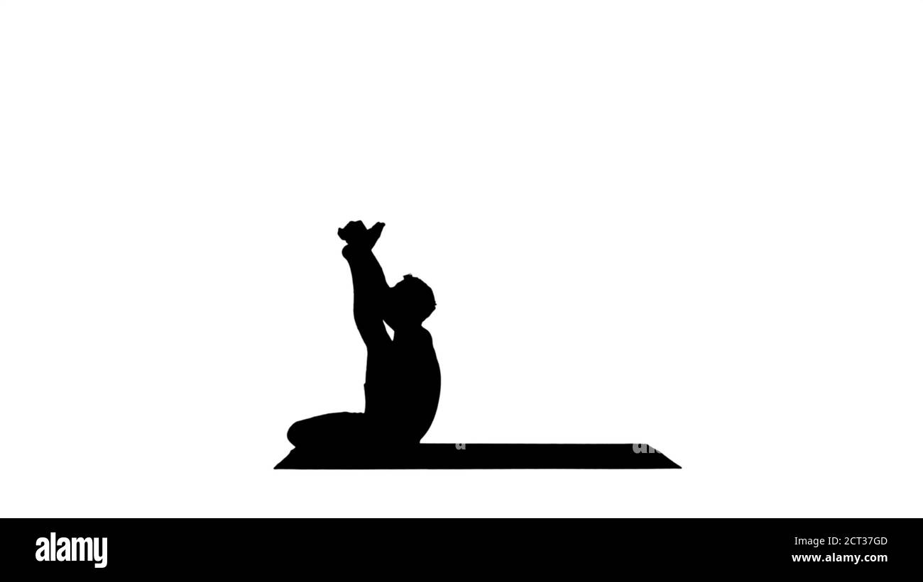 Silhouette enseignant de yoga masculin en posture héron. St. De hamstring intense Banque D'Images