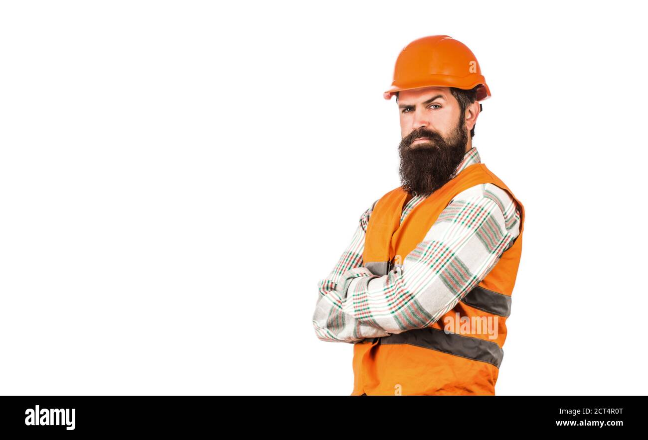 Ouvrier en uniforme de construction. Architecte constructeur. Homme barbu travailleur avec barbe dans un casque de construction ou un casque de sécurité. Constructeur en casque, contremaître ou Banque D'Images