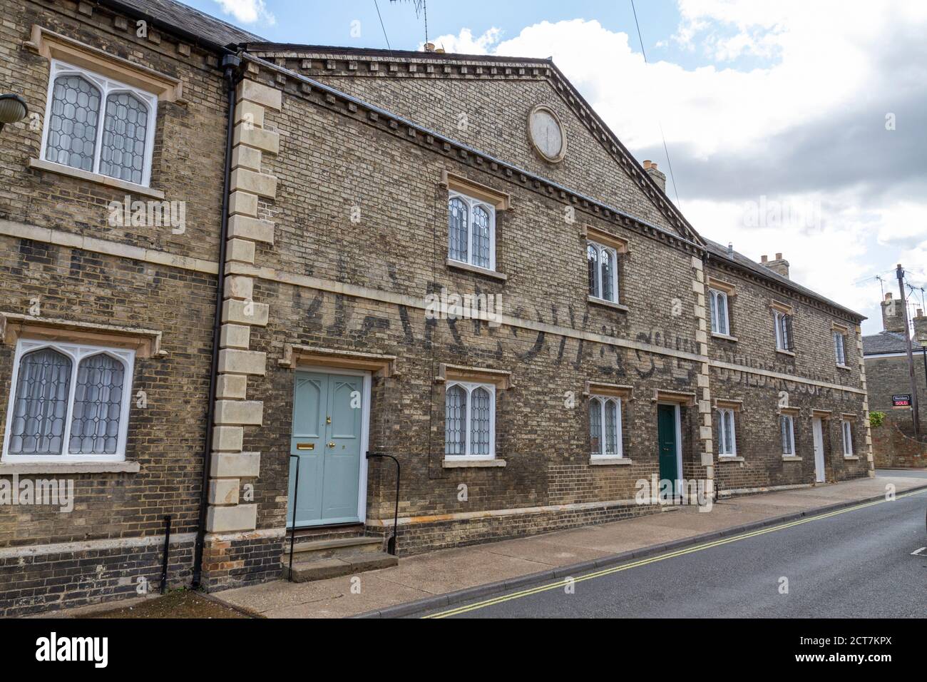 Maisons sous couvert de The Marlow & Co Ltd Builders Supplies, College Street, Bury St Edmunds, Suffolk, Royaume-Uni. Banque D'Images