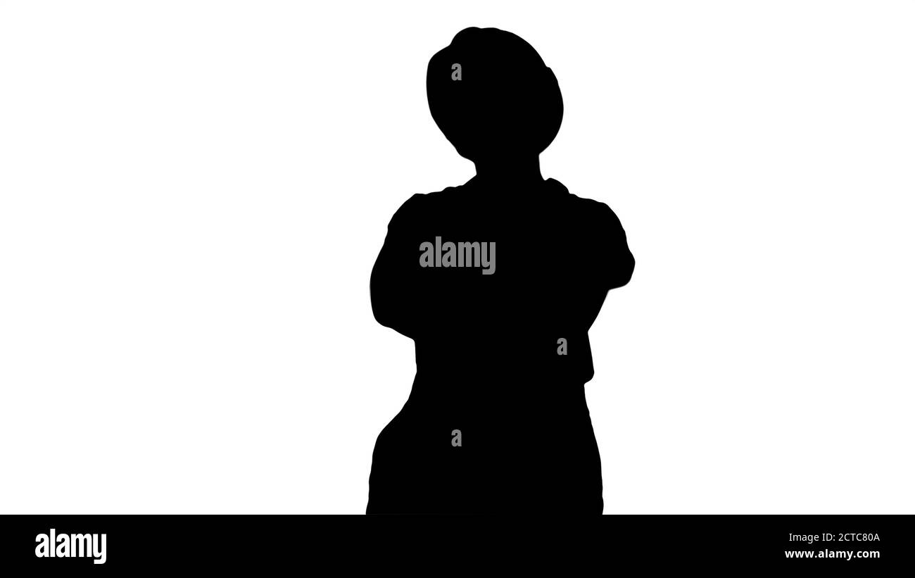 Silhouette souriante constructeur ouvrier femme debout et changeant Banque D'Images