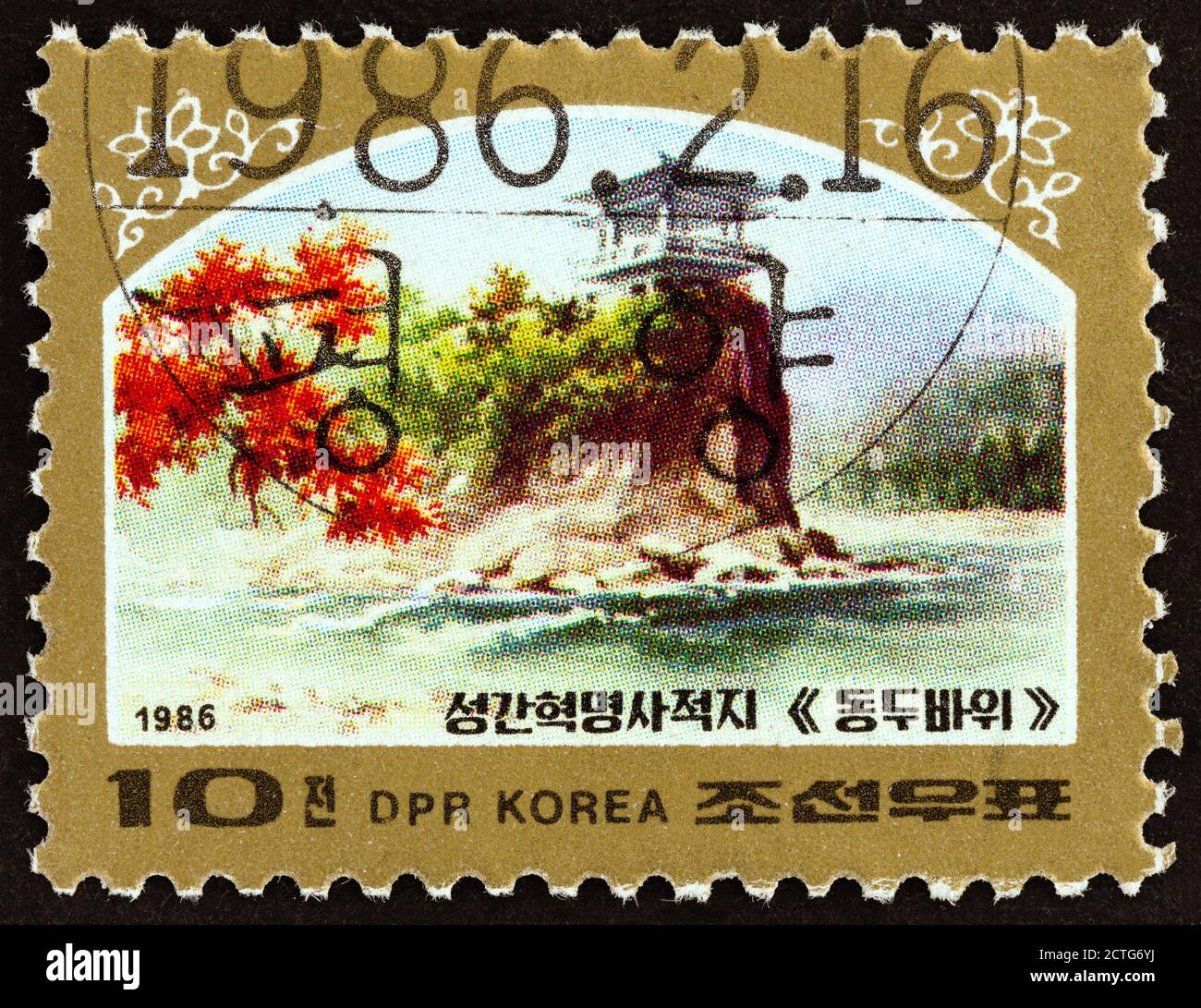 CORÉE DU NORD - VERS 1986 : un timbre imprimé en Corée du Nord montre le site révolutionnaire de Songga, vers 1986. Banque D'Images