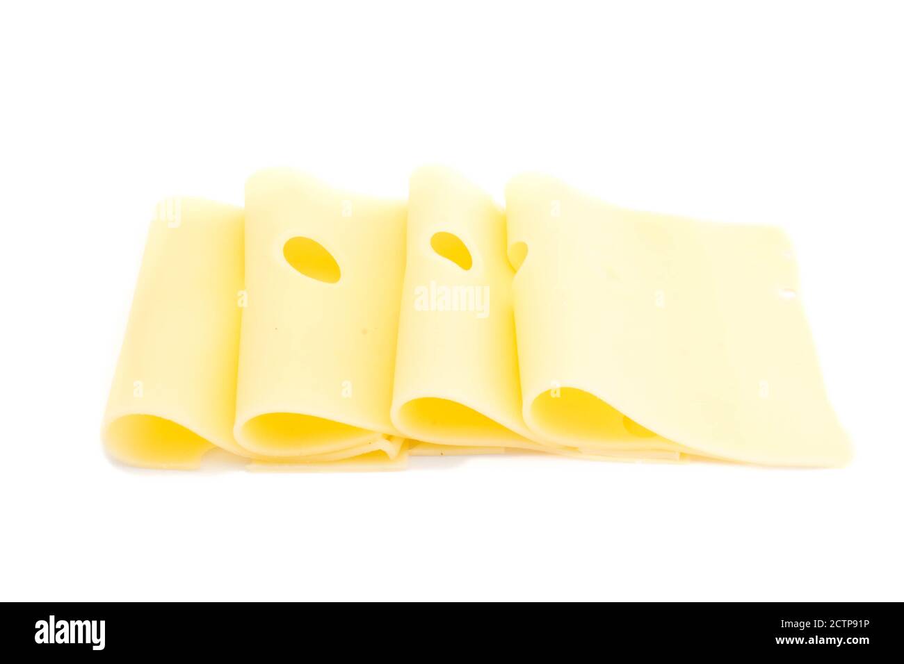 Tranches de fromage isolé sur fond blanc Banque D'Images
