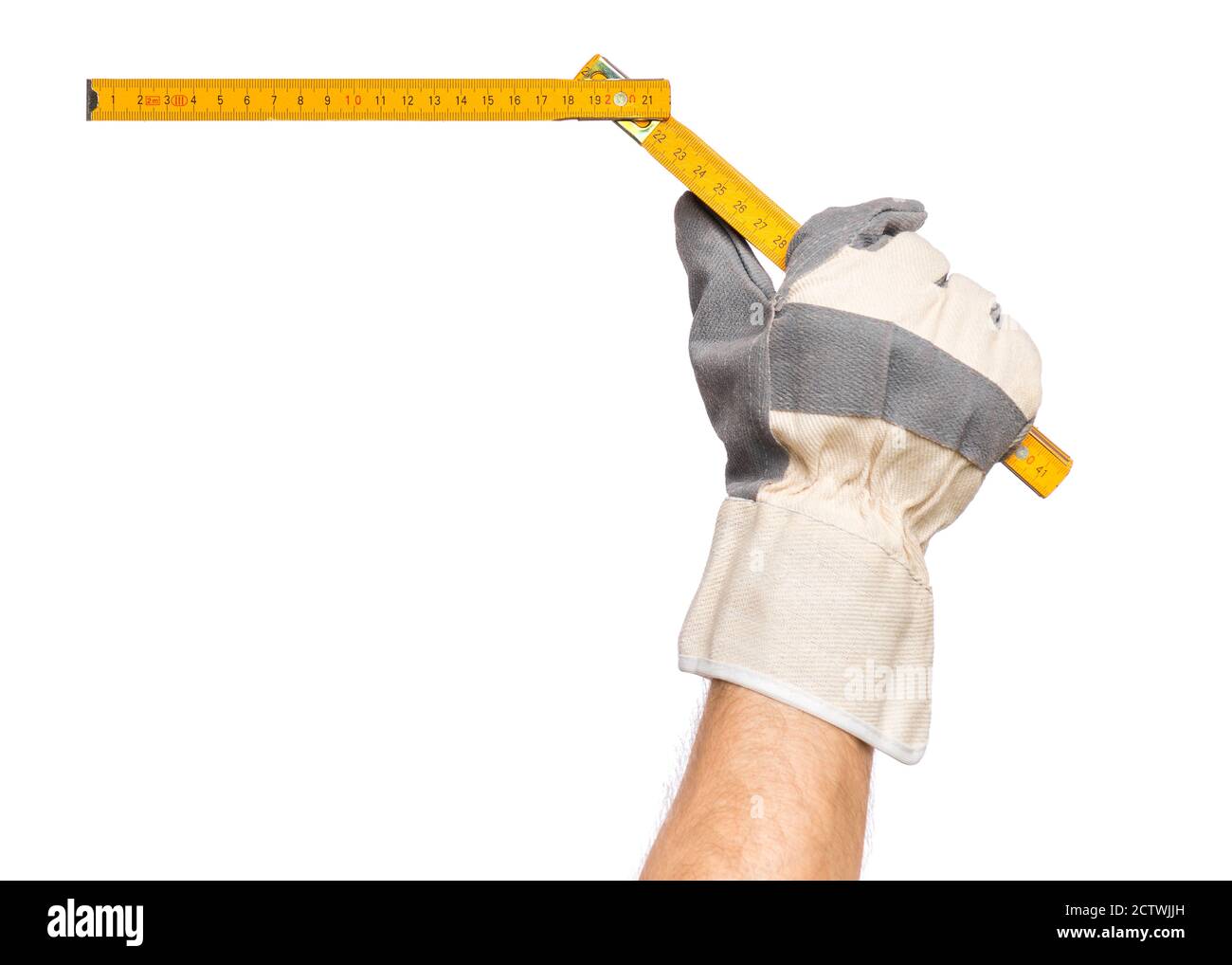 Main avec gant et mètre en bois Banque D'Images