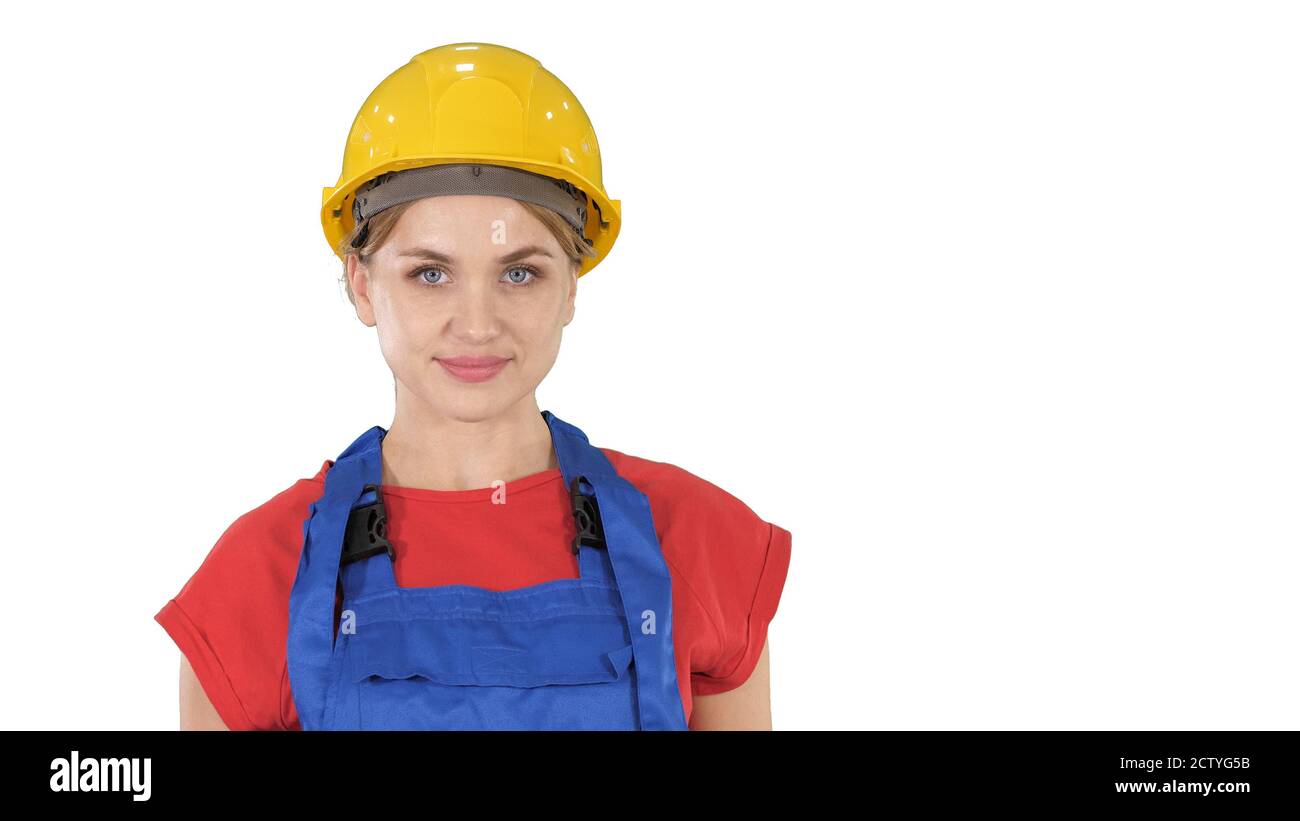 Femme souriante poseuse de constructeur debout et changeant poses FOL Banque D'Images