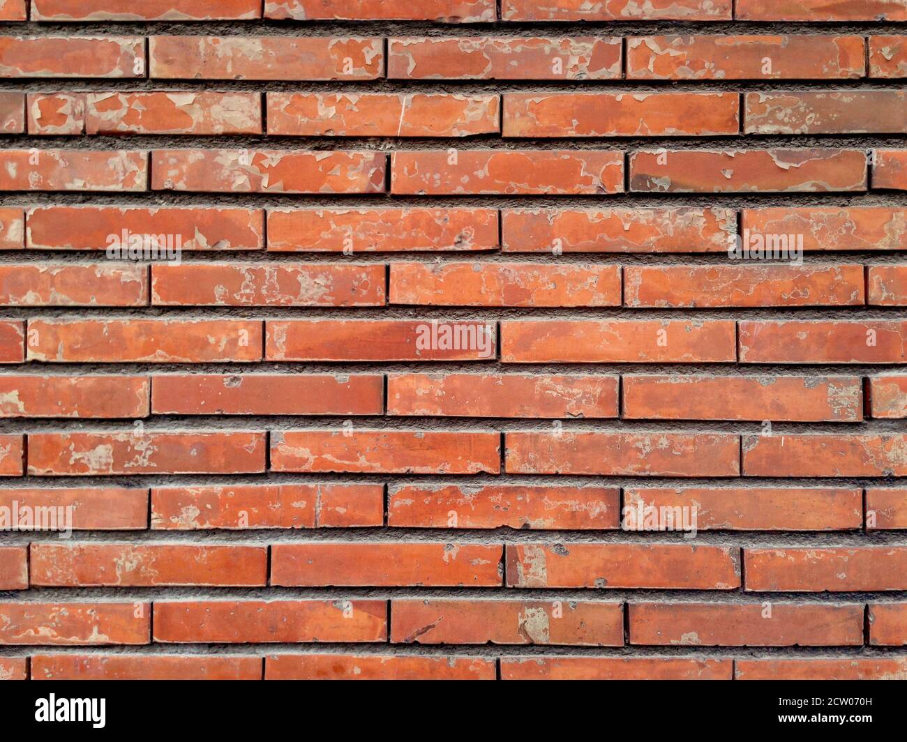 Texture sans couture avec un mur de briques détérioré. Banque D'Images