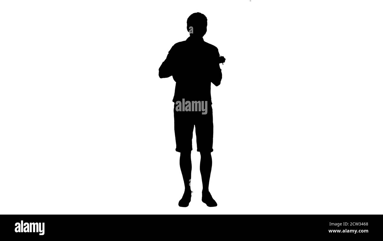 Silhouette homme italien jouant une guitare jouet. Banque D'Images