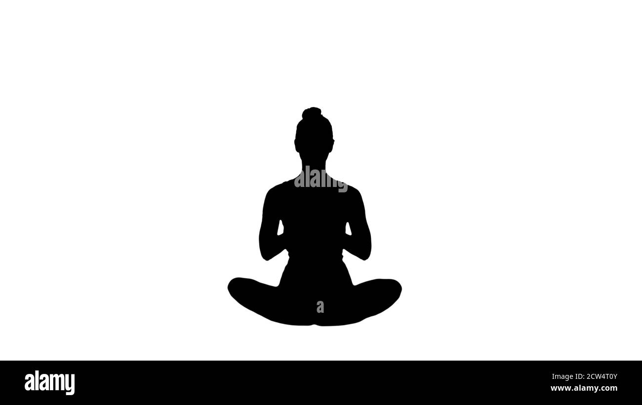 Silhouette belle jeune femme portant des vêtements de sport pratiquant y Banque D'Images