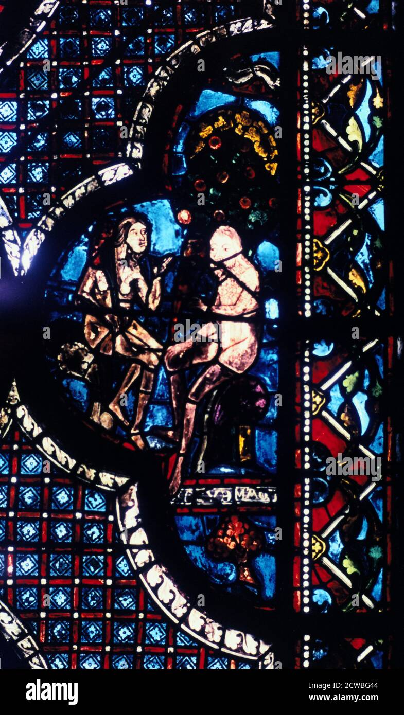 Adam et Eve, vitrail, Cathédrale de Chartres, France, 1205-1215. Du bon Samaritain et Adam et Eve dans la fenêtre côté sud. Banque D'Images