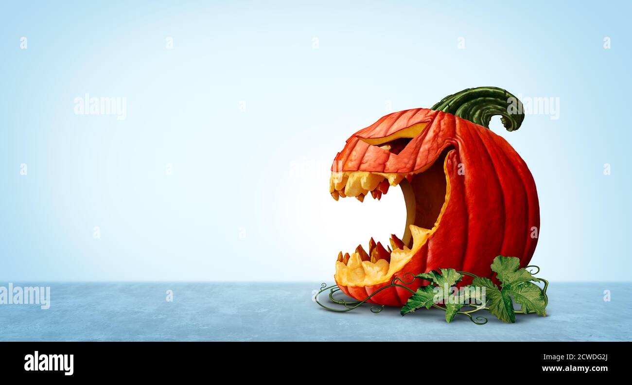 Citrouille d'Halloween avec arrière-plan de l'espace de copie comme un personnage de Jack o lanterne effrayant dans une vue latérale avec une bouche ouverte comme symbole pour l'automne et l'automne. Banque D'Images